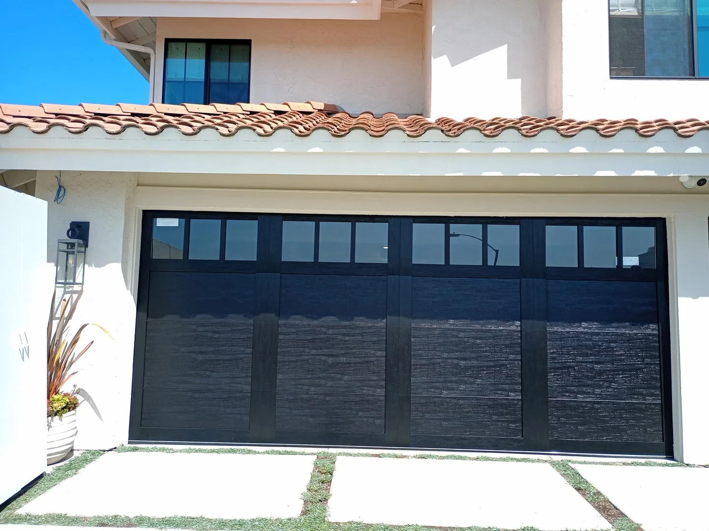 Modern insulated steel garage door installation in San Diego County