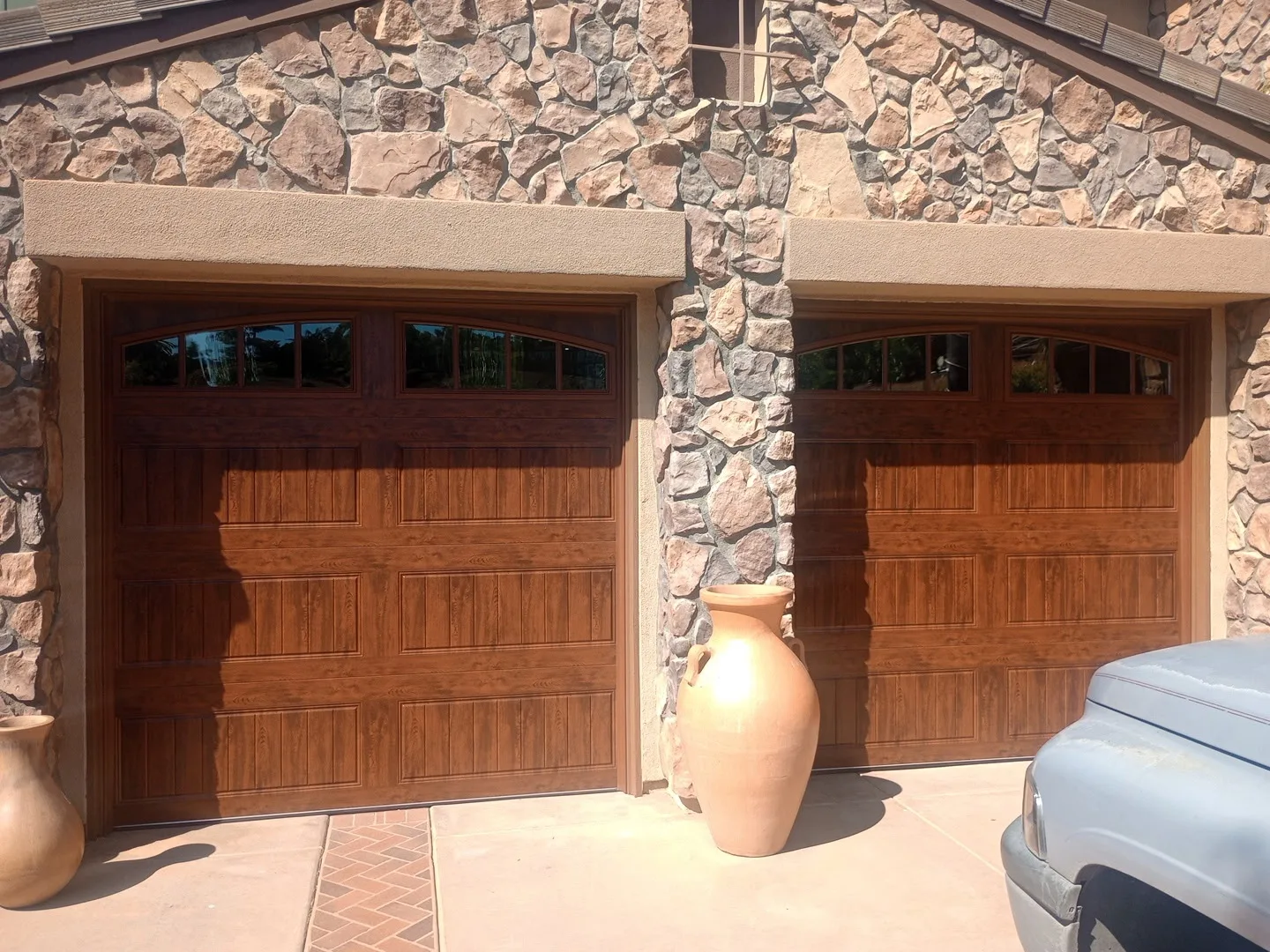 Contemporary garage door replacement by Castle Garage Doors & Gates