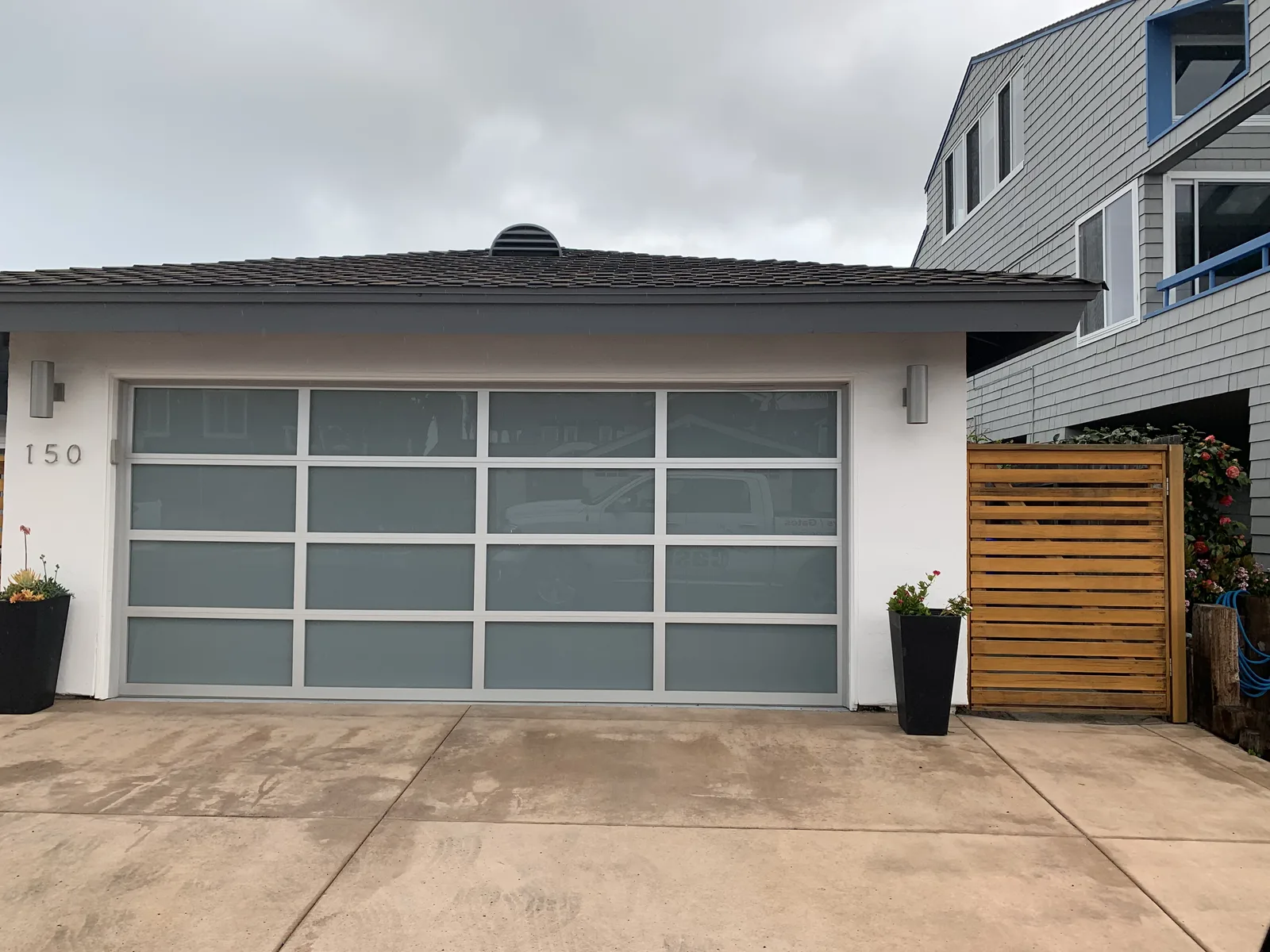Wood-look fiberglass garage door installation by Castle