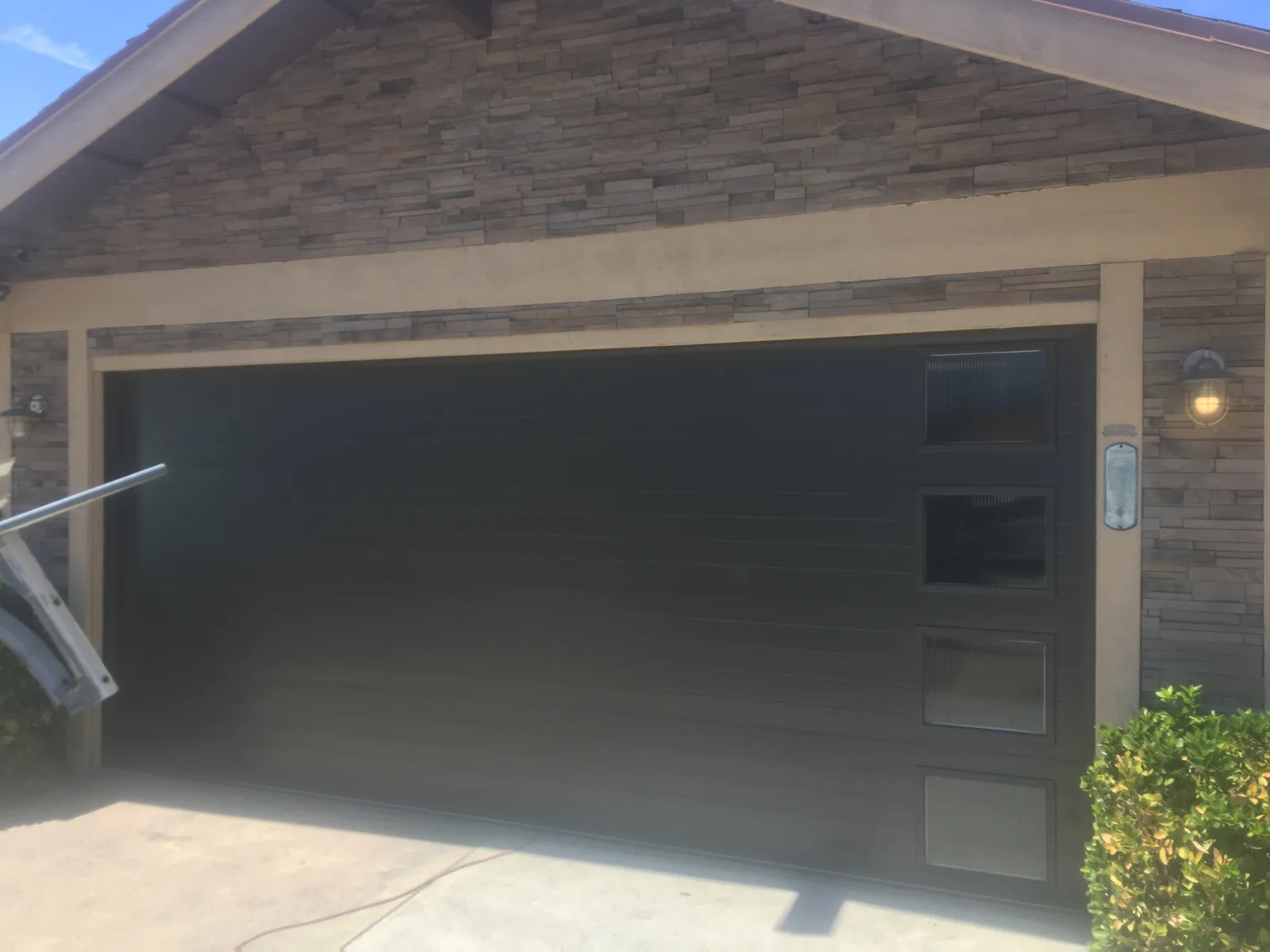 Classic white raised-panel garage door installation in San Diego