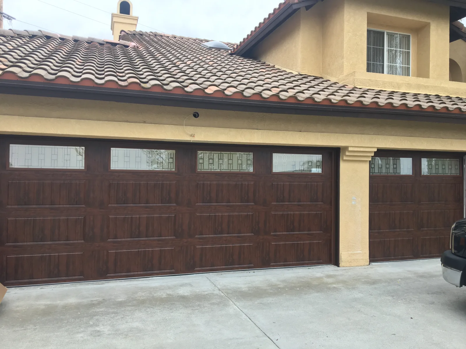 Modern aluminum garage door installation in San Diego
