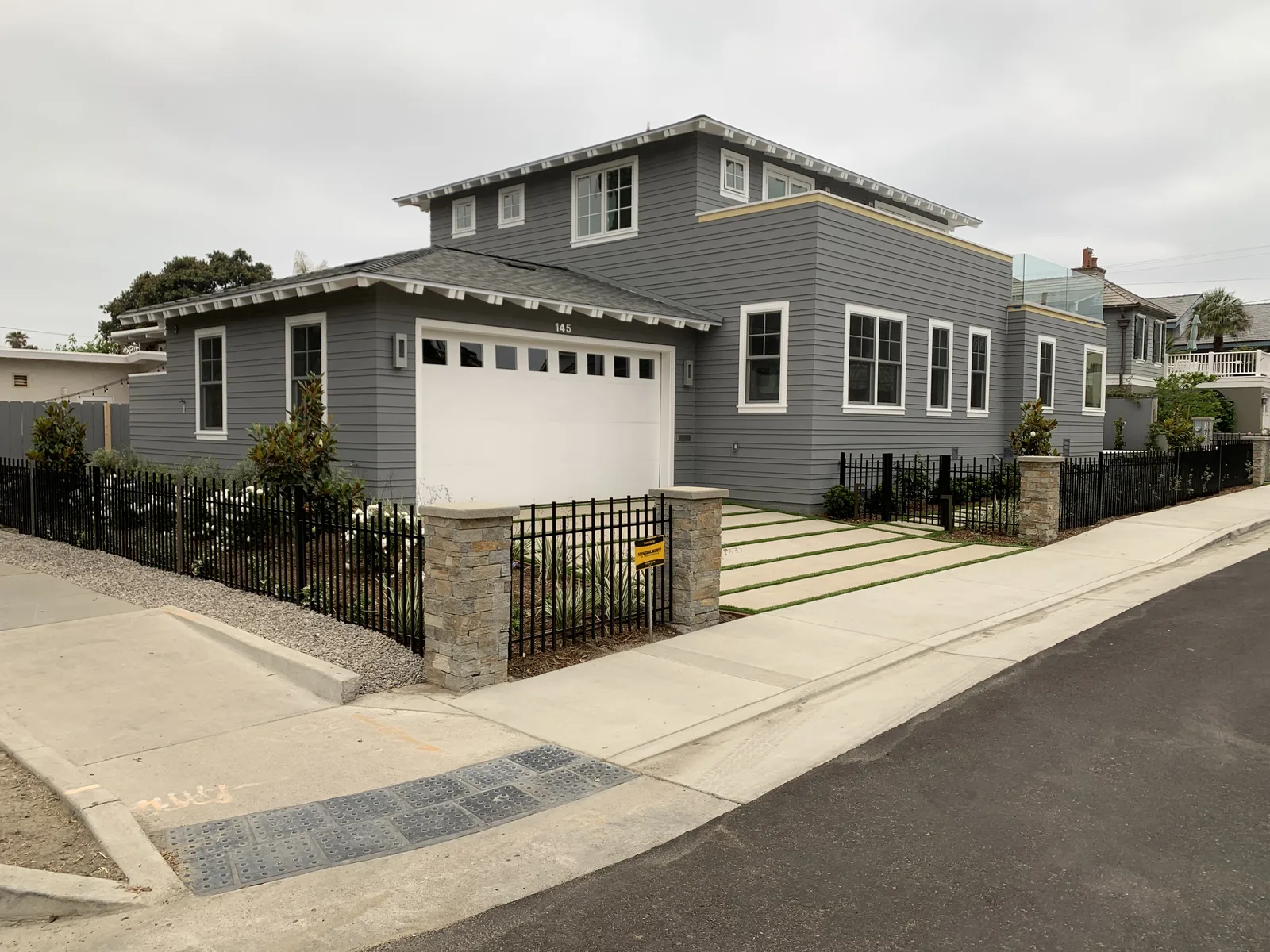 Steel garage door with windows installation in San Diego County