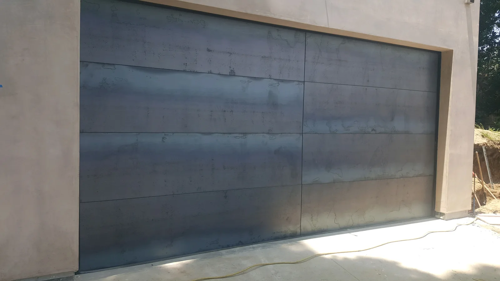 Traditional wood-look garage door in San Diego County