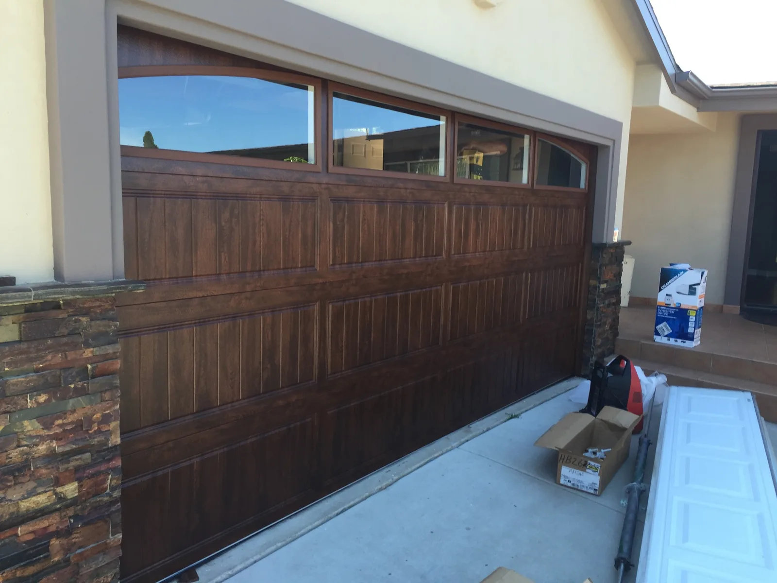 Residential garage door replacement by Castle Garage Doors
