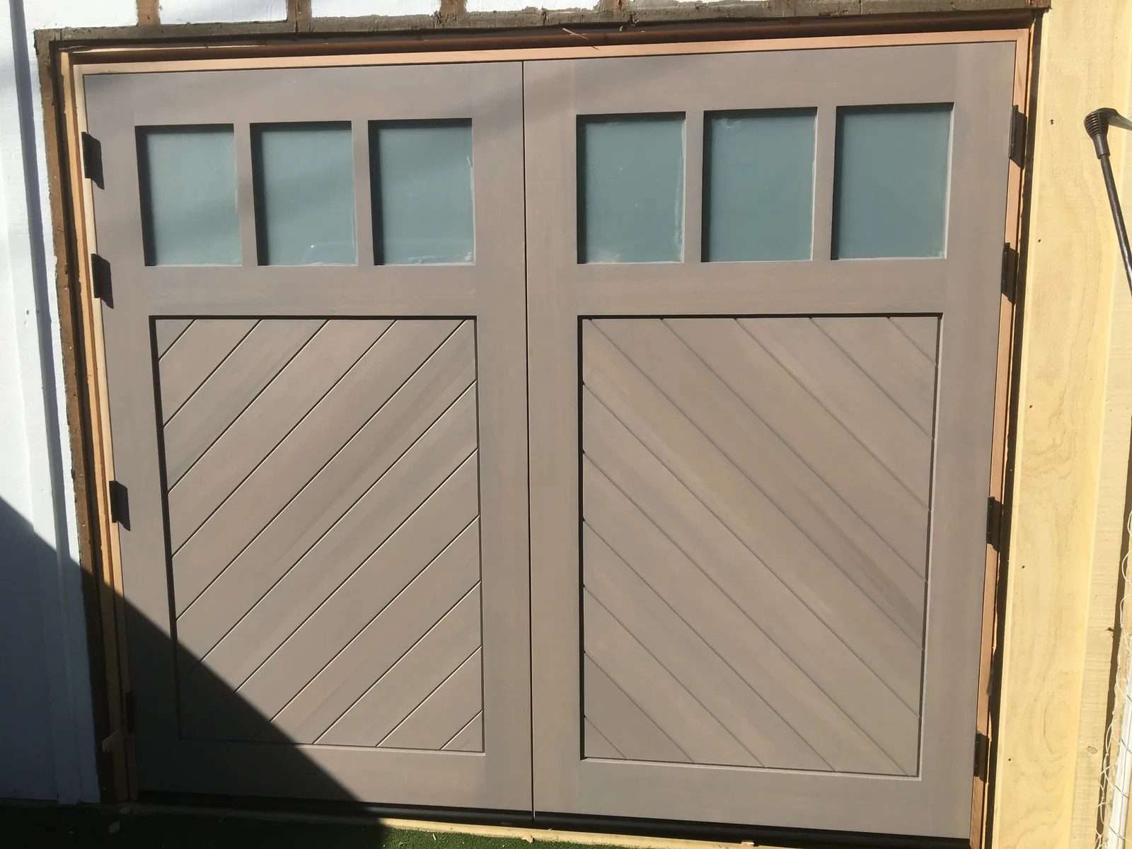 Modern panel garage door installation in San Diego County
