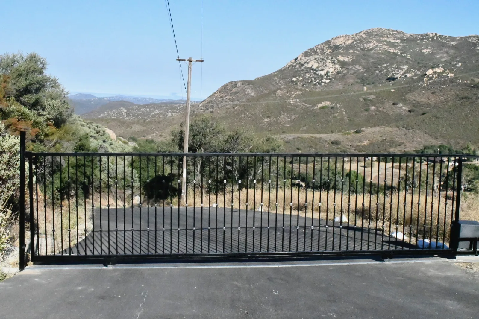 Ornamental driveway gate installation by Castle in San Diego County