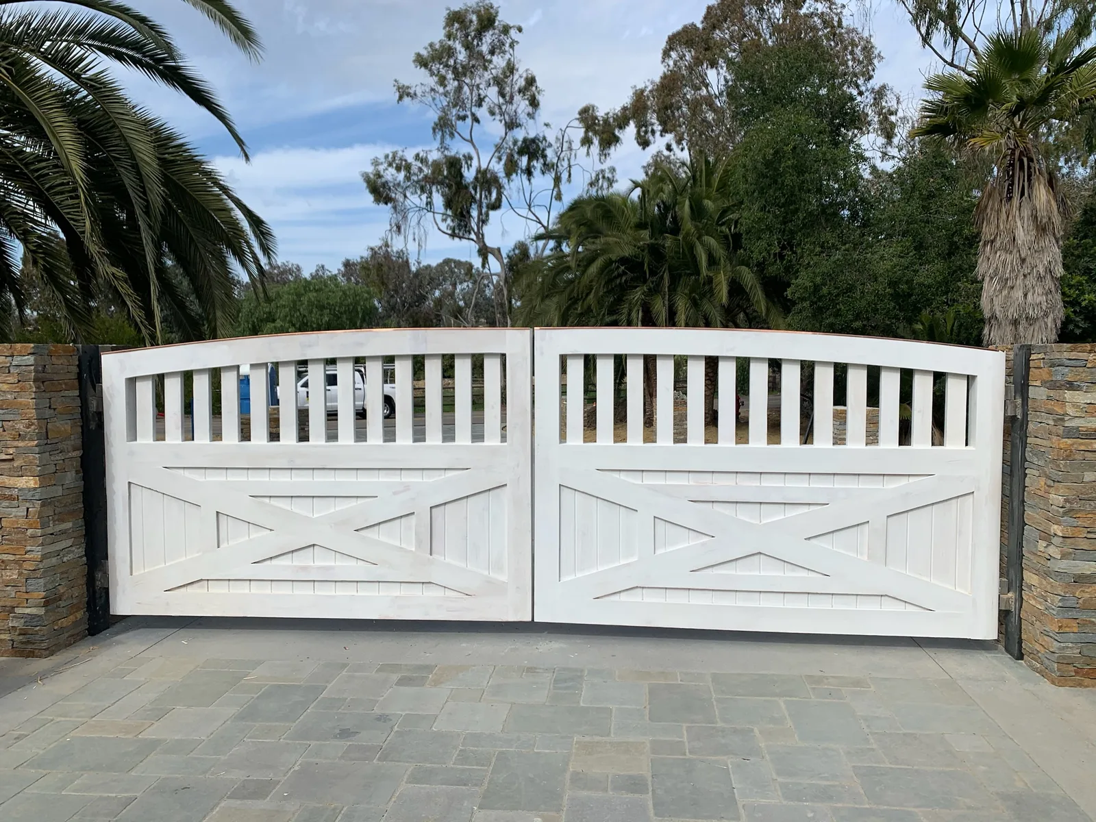 Custom iron gate installation by Castle Garage Doors & Gates