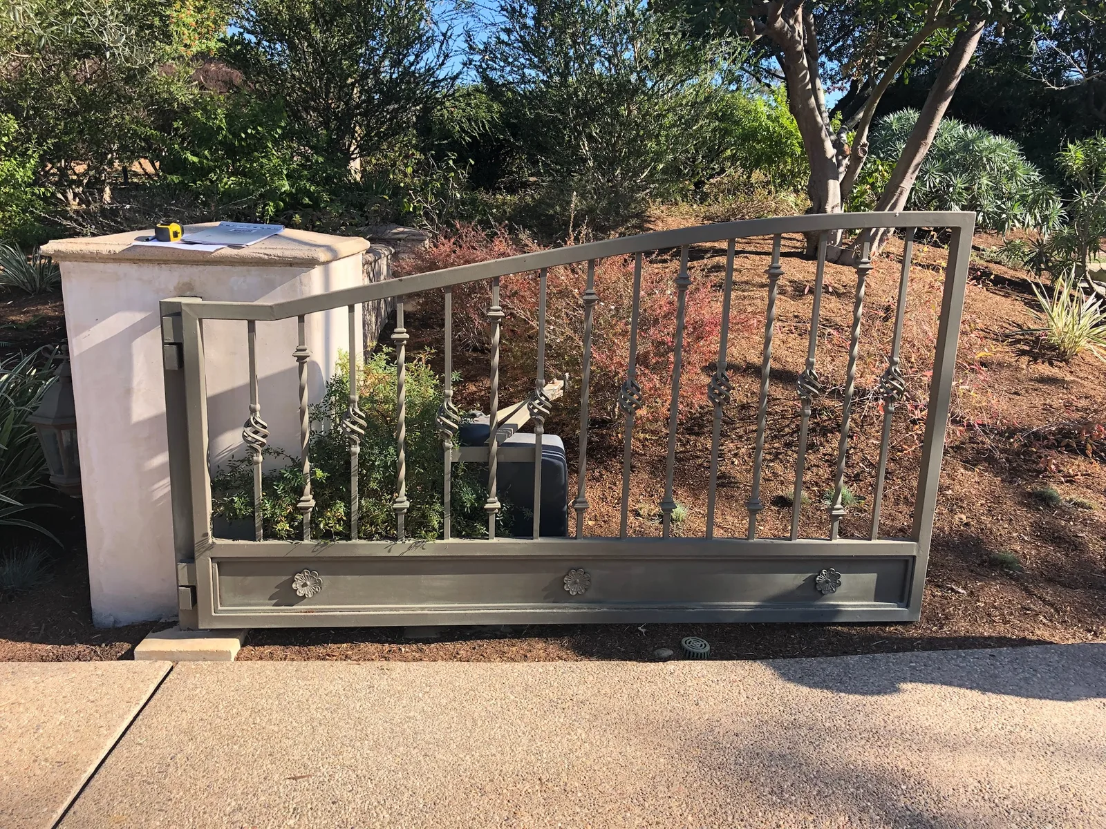 Residential sliding gate installation by Castle Garage Doors
